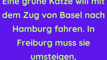 Eine grüne Katze will mit dem Zug